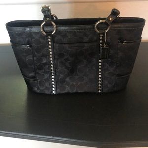 Coach black purse with shimmer C’s.